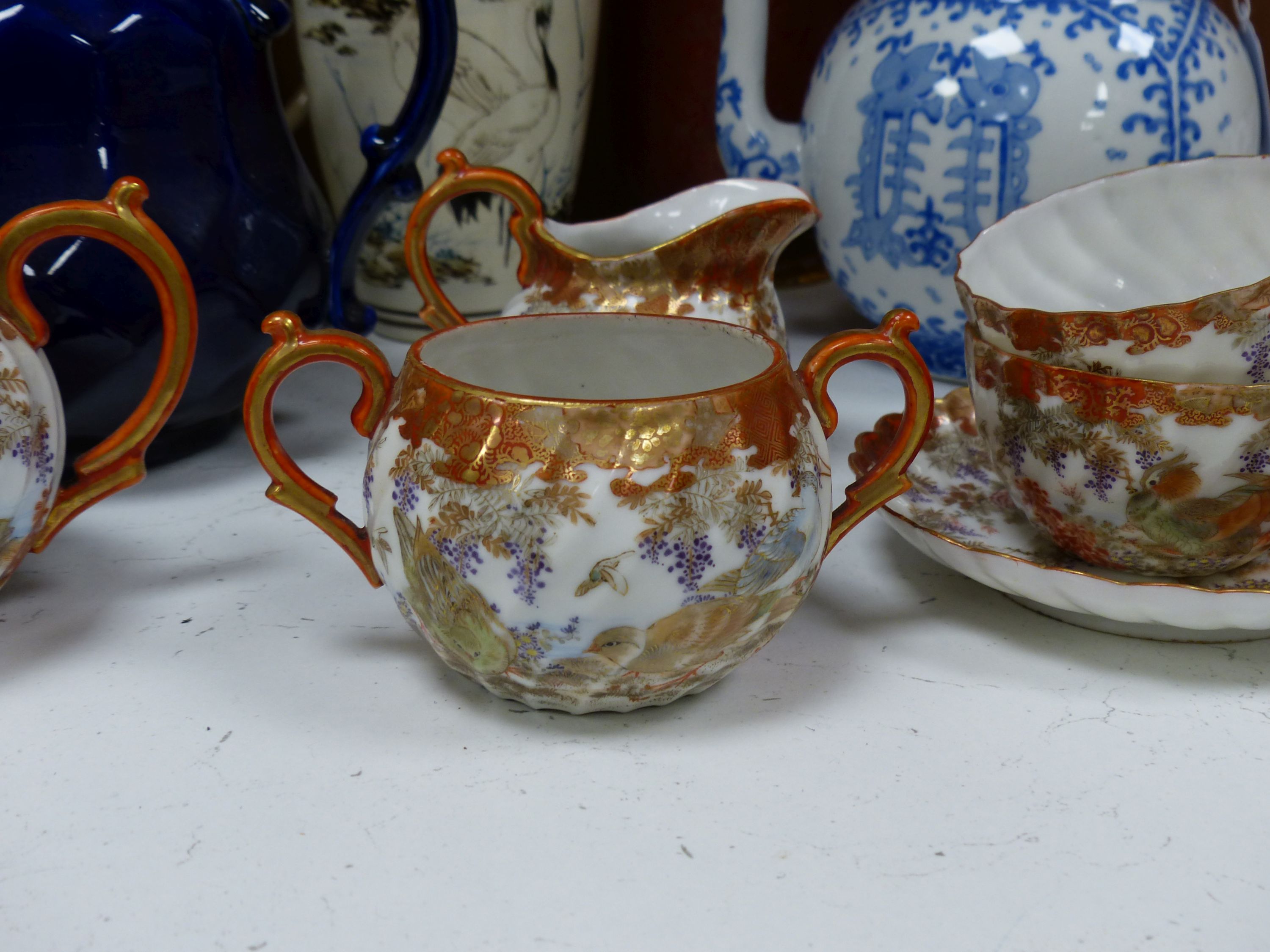 A Japanese blue and white tea kettle, Satsuma and Kutani wares etc